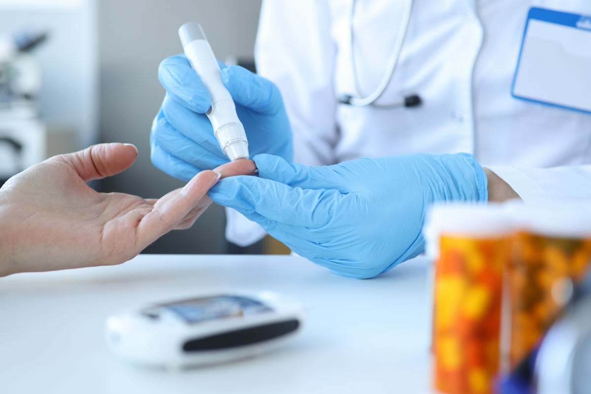 Doctor,Piercing,Patients,Finger,With,Lancet,In,Clinic,Closeup.,Blood