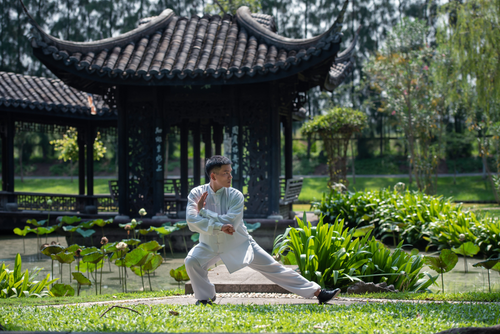 Asian,Man,Working,Out,With,Tai,Chi,In,The,Morning
