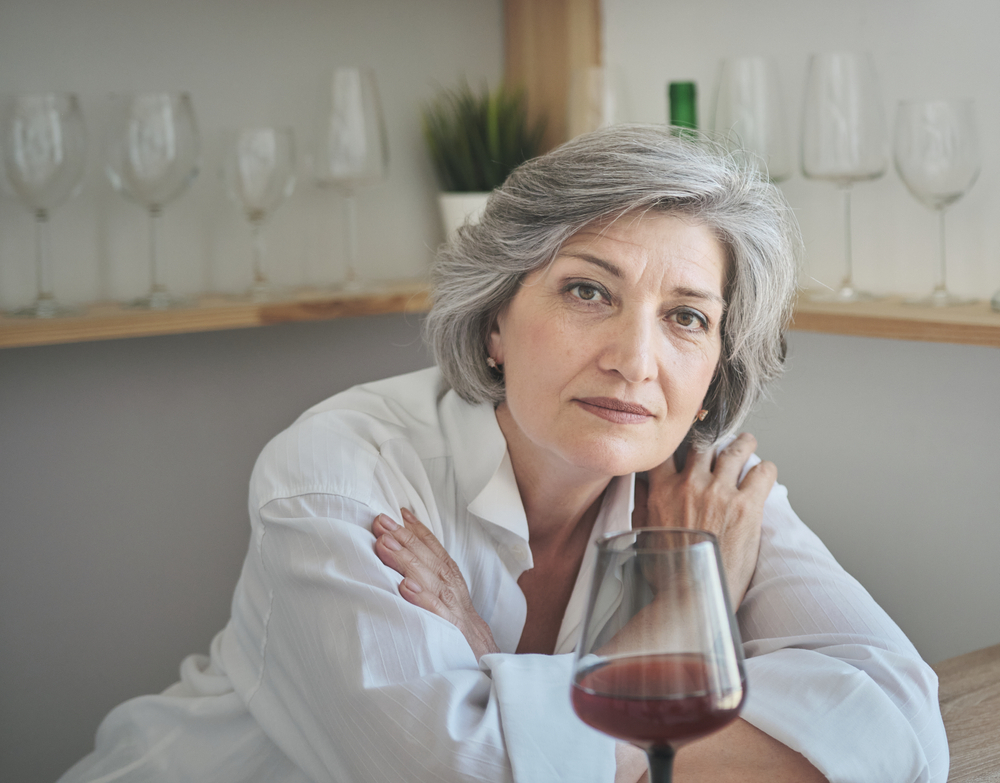 A,Elderly,Caucasian,Woman,Enjoys,A,Glass,Of,Red,Wine