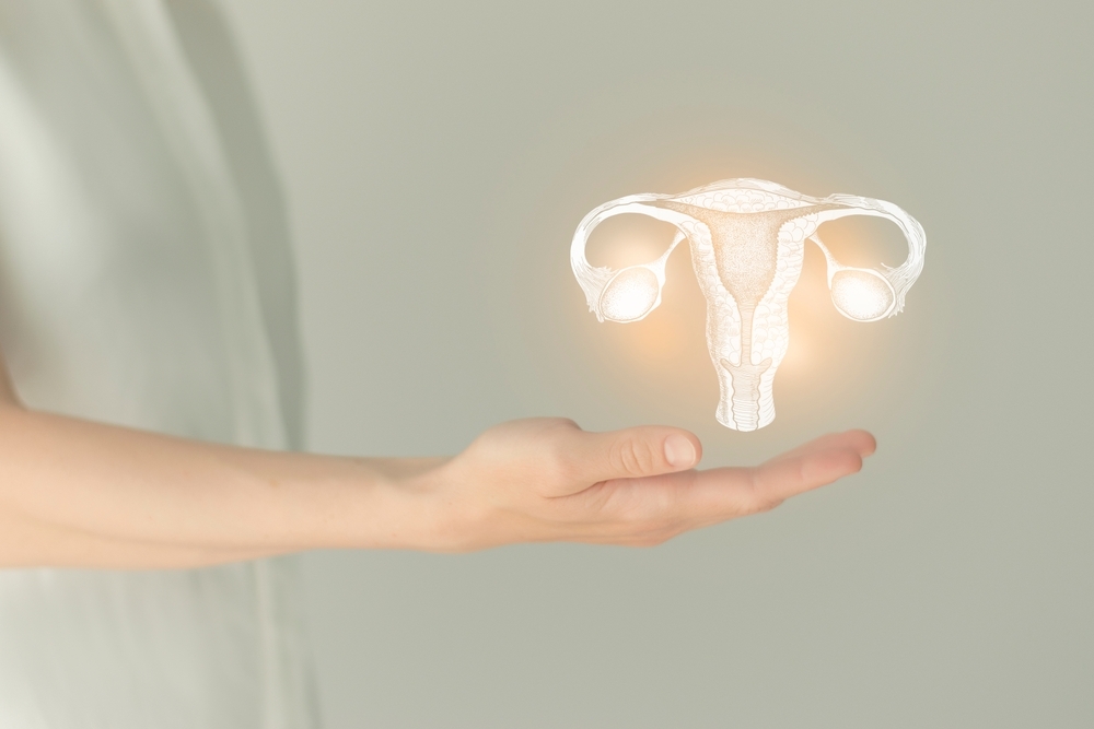 Unrecognizable,Female,Patient,In,White,Clothes,,Highlighted,Handrawn,Uterus,In