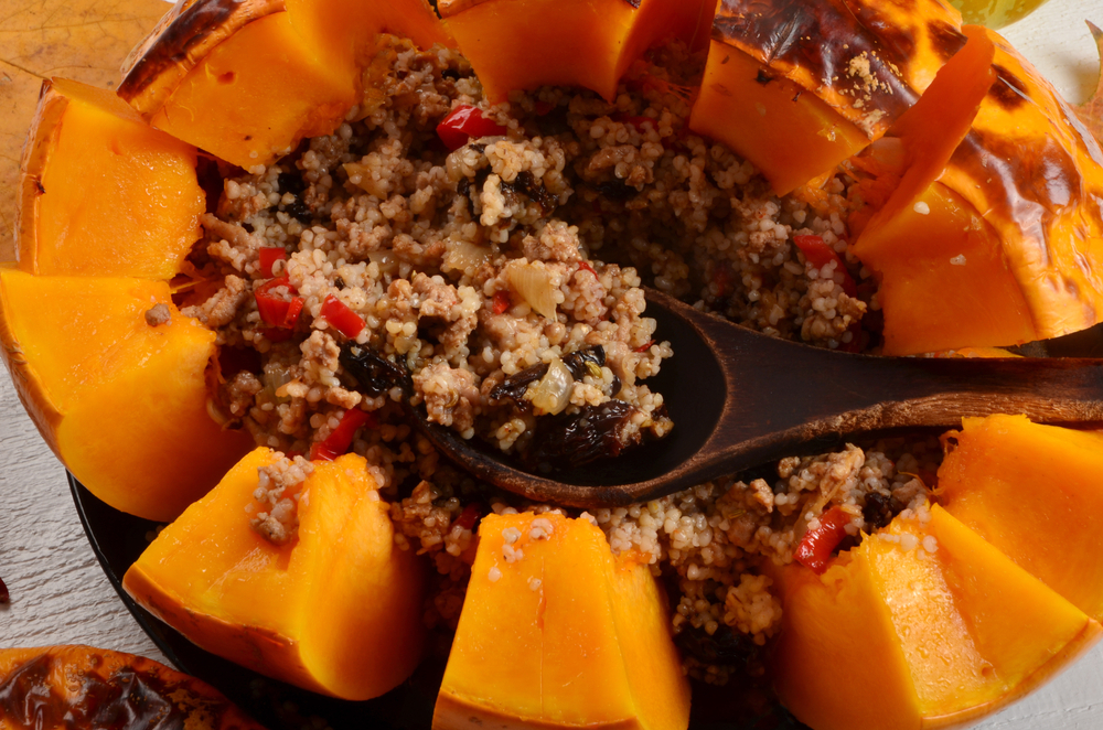 Baked,Whole,Pumpkin,Stuffed,With,Barley,,Meat,And,Vegetables,,Cut