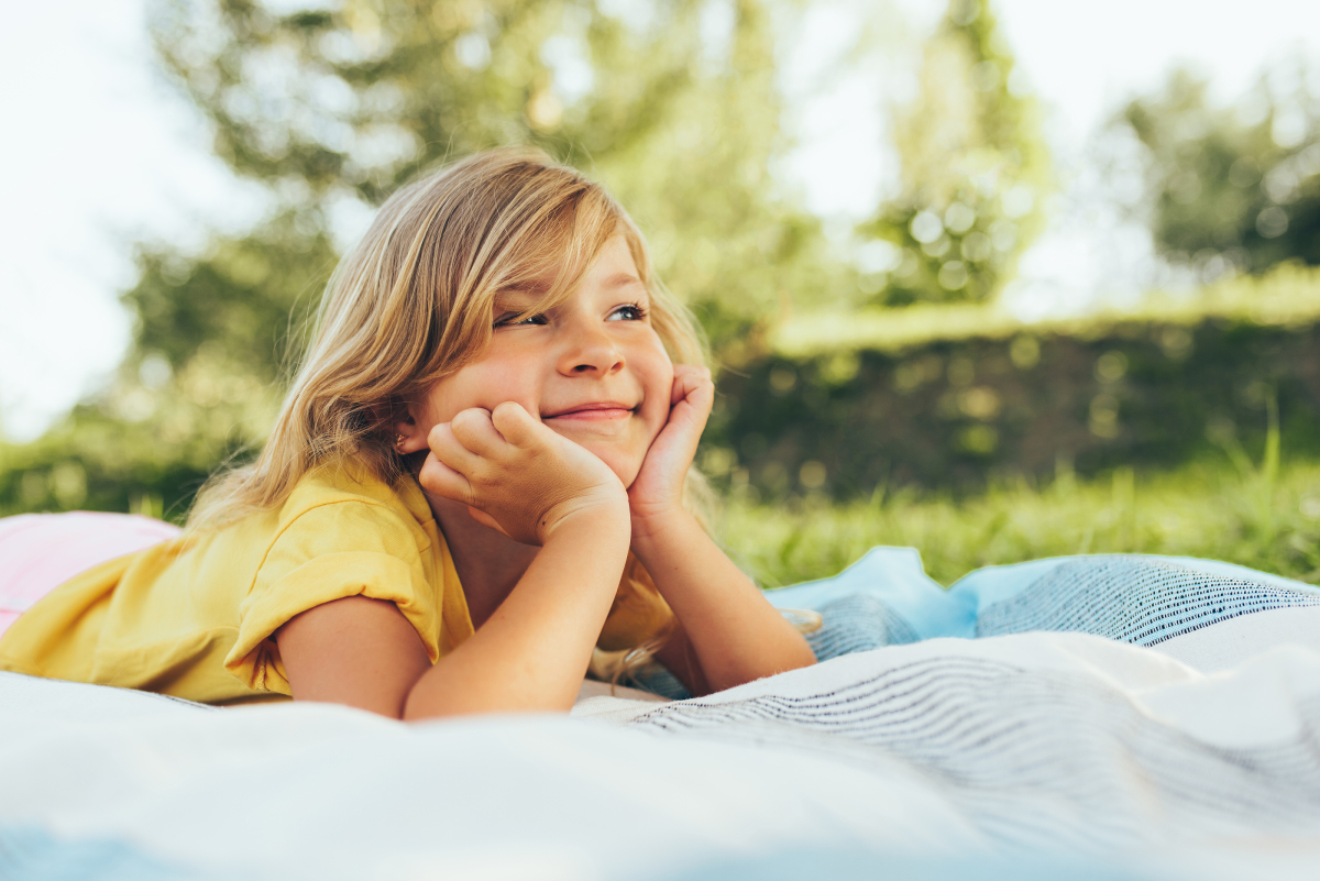 Image Of Adorable Blond Little Girl Playing At Nature Background