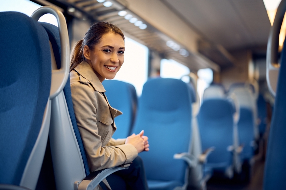 Young,Happy,Passenger,Enjoying,On,Her,Journey,By,Train,And