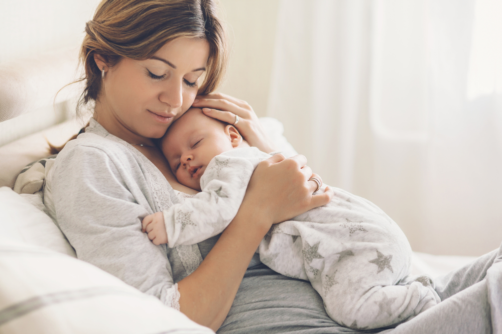 Loving,Mom,Carying,Of,Her,Newborn,Baby,At,Home.,Bright
