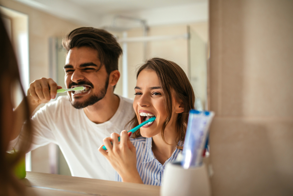 Couple,Doing,A,Morning,Hygiene,Together.