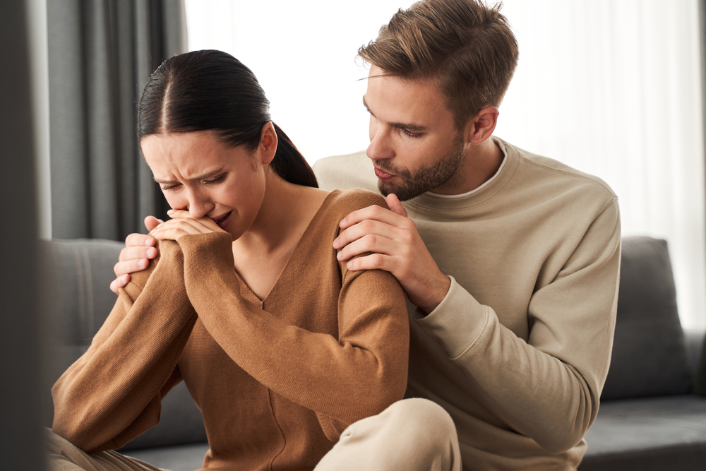 Couple,At,Home.,Handsome,Young,Man,Is,Calming,His,Upset