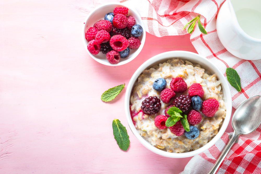 Oatmeal,Porrige,With,Milk,And,Berries,Top,View.