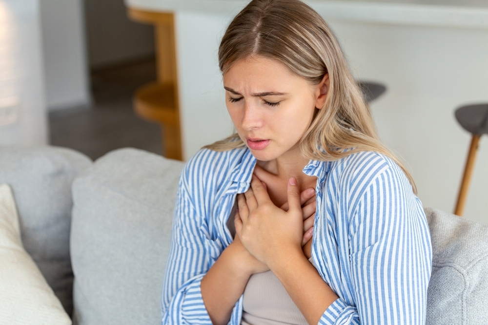 Young,Woman,Having,Chestpain,acute,Pain,,Possible,Heart,Attack.effect,Of,Stress