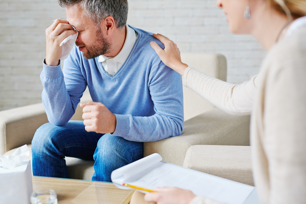 Crying,Man,With,Handkerchief,Sitting,By,His,Psychologist