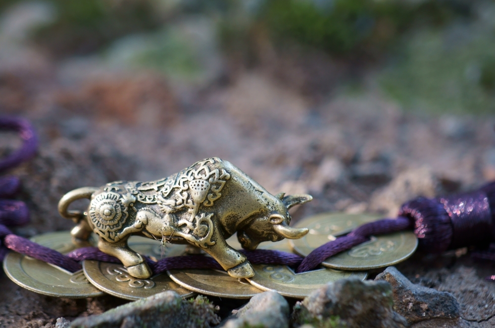 A,Metal,Bull,Figurine,With,Chinese,Coins.,Horoscope,And,Astrology.