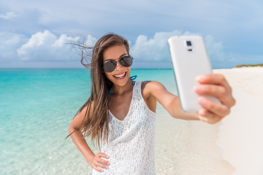 Cheerful,Young,Woman,Having,Fun,Taking,Smartphone,Selfie,Pictures,Of