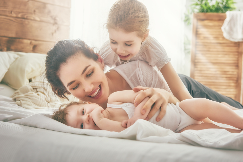 Happy,Loving,Family.,Mother,And,Her,Daughters,Children,Girls,Playing