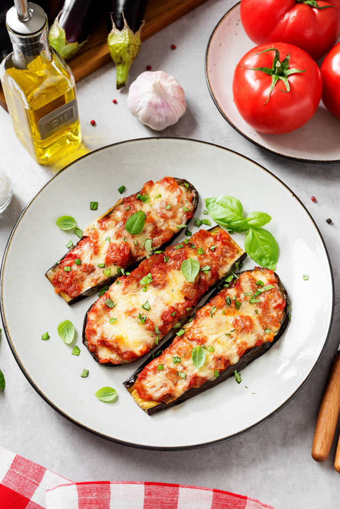 Baked,Eggplant,With,Mozzarella,Cheese,,Chopped,Tomatoes,And,Fresh,Basil