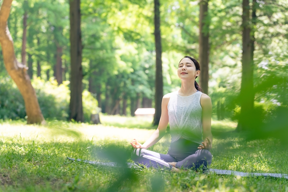 Asian,Woman,Meditating,In,The,Woods.,Forest,Yoga.,Mindfulness.