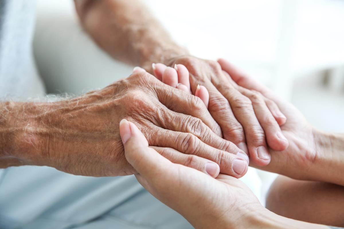 Young,Woman,Holding,Senior,Man,Hands,,Closeup