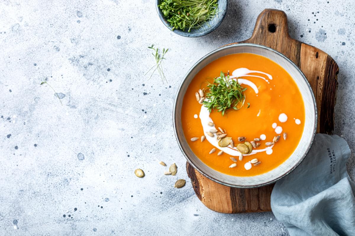 Vegetarian,Autumn,Pumpkin,And,Carrot,Soup,With,Cream,,Seeds,And