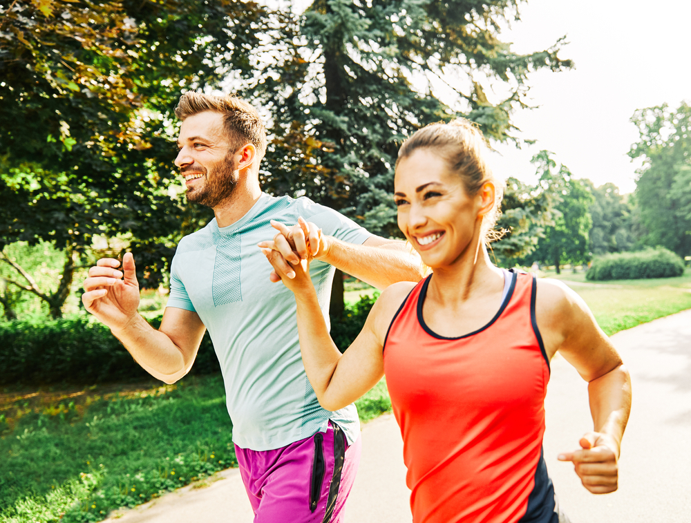 Portrait,Of,A,Young,Couple,Running,And,Exercising,In,A